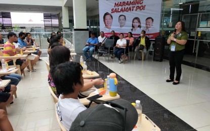 <p><strong>ASSISTANCE.</strong> Department of Human Settlements and Urban Development (DHSUD) Regional Director for Western Visayas Eva Maria Marfil talks to recipients of the Integrated Disaster Shelter Assistance Program before the release of the aid on Thursday (June 27, 2024) in Gaisano Timesquare in Iloilo City. She said the aid is for the owners of houses destroyed by calamities.<em> (PNA photo by PGLena)</em></p>