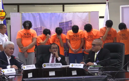 <p><strong>NABBED.</strong> NBI officials present seven individuals arrested for offering government positions in exchange for money, during a press conference in Quezon City on Monday (July 1, 2024). NBI Director Jaime Santiago said the group, which was apprehended on June 28, charges from PHP500,000 to PHP1 million in exchange for government positions.<em> (Photo screengrab from NBI Facebook page)</em></p>