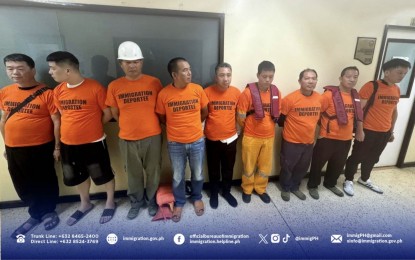 <p><strong>NABBED.</strong> Philippine immigration authorities arrest nine Chinese nationals suspected to be illegally working in vessels along Manila Bay in Parañaque City on June 29, 2024. The Bureau of Immigration on Monday (July 1) said the foreigners were arrested for illegally working in vessels along Manila Bay. <em>(Photo courtesy of BI)</em></p>