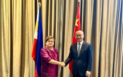 <p style="text-align: left;"><strong>DE-ESCALATING TENSIONS</strong><em>.</em> Foreign Affairs Undersecretary Ma. Theresa Lazaro and Vice Foreign Minister Chen Xiaodong shake hand during the 9th Meeting of the Bilateral Consultation Mechanism on the South China Sea in Manila on Tuesday (July 2, 2024). The Philippines and China have reaffirmed their commitment to de-escalate tensions in the South China Sea following the confrontation near Ayungin Shoal on June 17. <em>(Photo courtesy of DFA)</em></p>