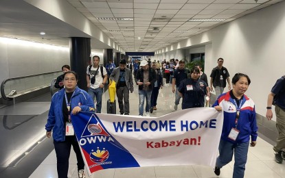 <p><strong>BACK HOME.</strong> Ten Filipino seafarers of M/V Transworld Navigator arrive at the Ninoy Aquino International Airport Terminal 3 on Tuesday evening (July 2, 2024), ahead of 12 other seafarers. All 27 Filipino crew members of the ship that was attacked by Houthi rebels last week are now back home. <em>(Photo courtesy of DMW)</em></p>
