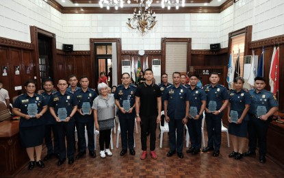 <p><strong>TOP COPS</strong>. Ilocos Norte Gov. Matthew Joseph Manotoc (8th from left) and Vice Gov. Cecilia Araneta-Marcos (6th from left) grace the awarding ceremony for Ilocos Norte’s Ten Outstanding Police Officers in the Service at the capitol session hall in Laoag City on Tuesday (July 9, 2024) . The police officers were recognized for their dedication in various fields.<em> (Contributed photo)</em></p>