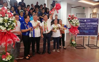 <p><strong>SHOWCASE.</strong> Antique acting Governor Edgar Denosta (4TH from left) leads the opening of the Micro, Small and Medium Enterprises (MSME) Week at the old Antique capitol on Tuesday (July 9, 2024). In his message, he encouraged MSMEs to continue innovating so they would become competitive and make their products sustainable. <em>(PNA photo by Annabel Consuelo J. Petinglay)</em></p>