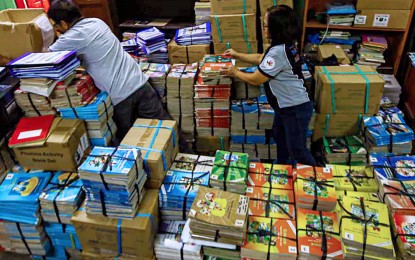 <p><strong>TEXTBOOKS.</strong> Teachers of the Bagong Silangan Elementary School in Quezon City prepare books and other learning materials on July 3, 2024. Education Secretary Sonny Angara on Tuesday (Sept. 10) said the Department of Education would transition from making its own books to title pre-selection to hasten the procurement of textbooks for basic education learners. <em>(PNA photo by Joan Bondoc)</em></p>