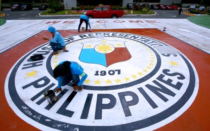 <p><strong>READY FOR SONA</strong>. Workers repaint the giant logo of the House of Representatives at the Batasang Pambansa Complex in Quezon City on July 4, 2024. Speaker Ferdinand Martin G. Romualdez on Tuesday (July 16, 2024) said preparations have been successful for another historic State of the Nation Address by President Ferdinand R. Marcos Jr. on July 22.<em> (PNA photo by Joan Bondoc)</em></p>