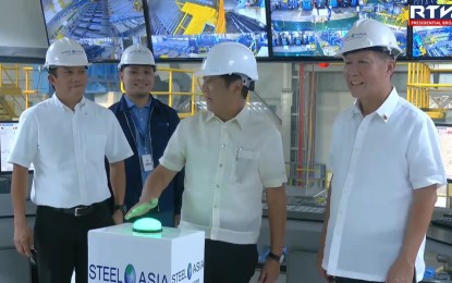 <p><strong>STEEL MILL</strong>. President Ferdinand R. Marcos Jr. and Benjamin Yao (right) lead the ceremonial switching on of Steel Asia Manufacturing Corporation's Compostela Works in Compostela, Cebu on Tuesday (July 9, 2024). President Marcos says the largest steel mill in Cebu is a step forward towards a sustainable steel industry that will solidify the Philippines' position in the global steel market.<em> (Screenshot from the RTVM video)</em></p>