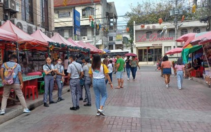 <p><strong>SHORTEST ROAD</strong>. Pedestrians enjoy the mood at Zamora Street, the shortest road in Cebu City connecting the Basilica Minore del Sto. Niño and the Cebu Metropolitan Cathedral. Acting Mayor Raymond Alvin Garcia on Tuesday (July 9, 2024) said the city government is forming a task force that will recover illegally occupied properties to boost infrastructure development and provide housing units for the homeless.<em> (PNA photo by John Rey Saavedra)</em></p>