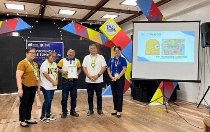 <p><strong>BAGWIS AWARD.</strong> Engineer Edwin Eraga (third from left) receives the Gold Bagwis Award in the service category from the Department of Trade and Industry during the opening ceremony of the Micro, Small and Medium Enterprises (MSME) Week on Tuesday (July 9, 2024). Eraga, in an interview on Wednesday (July 10), said they are motivated to further improve their services after winning the award for the second time. <em>(Photo courtesy of DTI Antique)</em></p>