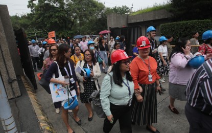 <p><strong>DISASTER PREPAREDNESS.</strong> Department of Foreign Affairs employees participate in an earthquake drill at the central office on Roxas Boulevard, Pasay City on Thursday (July 11, 2024). Private and public offices are encouraged to perform drills to prepare occupants in case a major earthquake or disaster strikes. <em>(PNA photo by Avito Dalan)</em></p>