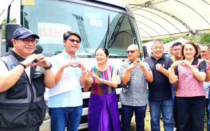 <p><strong>MOBILE CLINIC</strong>. First Lady Liza Araneta-Marcos (third from left) and Health Secretary Teodoro Herbosa (leftmost) lead the distribution of mobile primary care facilities (PCF) to executives of different provinces during the event in Clark Freeport Zone in Pampanga on Wednesday (July 10, 2024). All the six provinces in the Cordillera Administrative Region each received a PCF. <em>(Photo courtesy of Novy Del Rosario Afidchao/ MP PIO)</em></p>