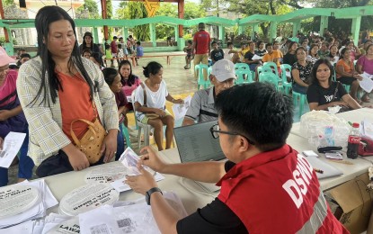 <p><strong>CASH FOR WORK</strong>. Beneficiaries of the cash for work and training of the Department of Social Welfare and Development (DSWD) Bicol receive cash aid during the payout in Catanduanes from July 8 to 10, 2024. The DSWD released PHP6.8 million to 862 partner-beneficiaries of the Project LAWA at BINHI<em>. (Photo courtesy of DSWD)</em></p>