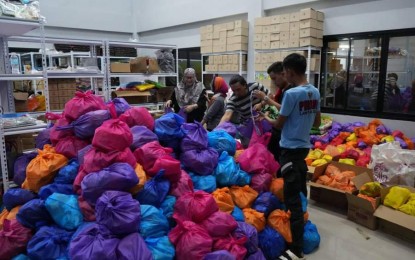 <p><strong>RELIEF RESPONSE.</strong> Different offices comprising the Lanao del Sur Provincial Disaster Risk Reduction Management Council prepare relief goods on Wednesday (July 10, 2024) for victims of flooding in four towns. The relief packs will be distributed to the 4,990 affected households in Malabang, Balabagan, Kapatagan, and Marogong. <em>(Photo courtesy of Lanao Sur PIO)</em></p>