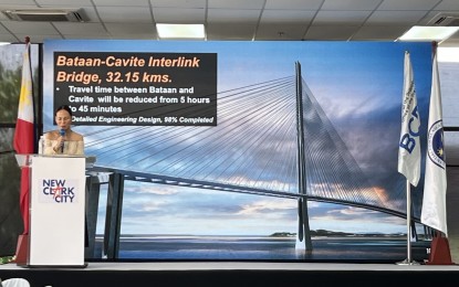 <p><strong>MEGA BRIDGE.</strong> Department of Public Works and Highways (DPWH) Undersecretary Maria Catalina Cabral talks about the 32-kilometer Bataan-Cavite Interlink Bridge during the Build Better More Infrastructure Forum at New Clark City in Capas, Tarlac on Thursday (July 11, 2024). The mega bridge aims to reduce travel time between the provinces of Bataan and Cavite from five hours to just 45 minutes, bypassing Metro Manila through Manila Bay. <em>(PNA photo by Darryl John Esguerra)</em></p>