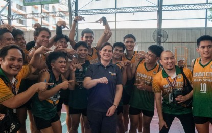 <p><strong>CHEERLEADER. </strong>Vice President and outgoing Education Secretary Sara Duterte celebrates with the Davao Region secondary boys volleyball team at University of San Jose-Recoletos Basak Campus in Cebu City, Cebu on Wednesday (July 10, 2024). Davao beat Cagayan Valley, 25-20, 25-20, at the start of the Palarong Pambansa volleyball tournament. <em>(Photo courtesy of DepEd Philippines Facebook)</em></p>