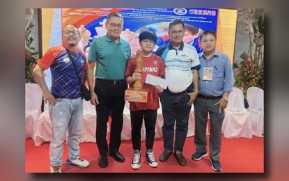 <p><strong>​CHAMPION.</strong> International Master (IM) Daniel Quizon (center) with Asia's First Grandmaster Eugene Torre​ during the awarding ceremony of the 2nd Gov. Henry Oaminal Open​ rapid ​chess​ tournament at the AYA Hotel and Residences in Clarin, Misamis Occidental on​ July 10, 2024. He tallied 7.5 points to earn PHP100,000 in cash. <em>(Contributed photo) </em></p>