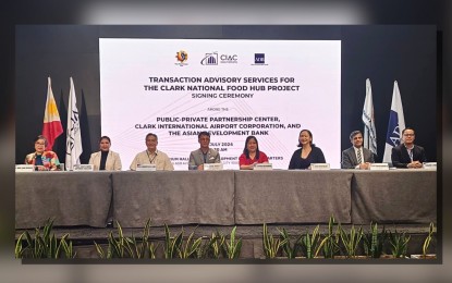 <p><strong>FOOD HUB</strong>. CIAC president Arrey Perez (4th from left), PPP center executive director Ma. Cynthia Hernandez (5th from left), and ADB country director for the Philippines Pavit Ramachandran (2nd from right) sign an agreement for technical advisory services in the establishment of the 62-hectare National Food Hub in Clark, at the ADB headquarters in Mandaluyong on Friday (July 12, 2024). Also attending were Undersecretary Cheryl Marie Natividad-Caballero of the Department of Agriculture, Undersecretary Mary Jean Pacheco of the Department of Trade and Industry, ADB office of markets development and PPP head F. Cleo Kawawaki, Transportation Undersecretary for Aviation Roberto CO Lim, and PPP Deputy Executive Director Eleazar Ricote. <em>(PNA photo by Leah Gonzales)</em></p>