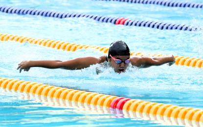 <p><strong>GOLDEN.</strong> Micaela Jasmine Mojdeh of Calabarzon Region swims way to the girls' 13-18 100-meter butterfly gold in the Palarong Pambansa at Cebu City Sports Center on Saturday (July 13, 2024). It was her fourth win after ruling the 200m breaststroke, butterfly and Individual Medley events. <em>(PSC Media Pool)</em></p>