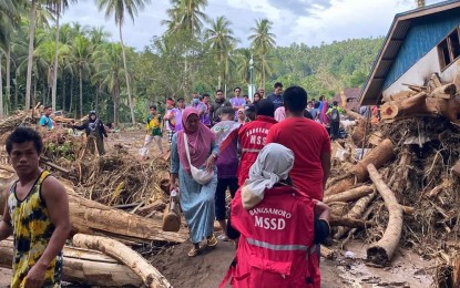 <p><strong>HELPING HAND.</strong> Personnel of the Bangsamoro Ministry of Social Services and Development visit the town of Matanog in Maguindanao del Norte to bring aid to flood victims and assess their situation in this July 11, 2024 photo. The National Disaster Risk Reduction and Management Council (NDRRMC) on Monday (July 15, 2024) said two persons have been reported dead due to bad weather caused by the southwest monsoon that battered a large part of Mindanao. <em>(Photo courtesy of Bangsamoro Ministry of Social Services and Development)</em></p>