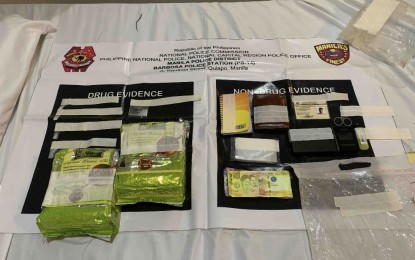 <p><strong>BUY-BUST.</strong> Drug and non-drug evidence are seized in a buy-bust operation in Sampaloc, Manila on Tuesday (July 16, 2024). The National Capital Region Police Office (NCRPO) arrested two suspects and seized PHP13.6 million worth of shabu during the operation. <em>(Photo courtesy of NCRPO)</em></p>