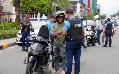 <p><strong>SAFETY REASONS.</strong> Motorcycle riders stop at a checkpoint along Macapagal Boulevard, Pasay City on Monday (July 15, 2024) for a security check. The Department of the Interior and Local Government (DILG) on Thursday (Aug. 15, 2024) reported a 3.29 percent drop in total crime incidents nationwide during the first half of the year.<em> (PNA photo by Avito Dalan)</em></p>