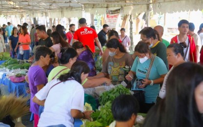 <p><strong>INCOME-GENERATING</strong>. Pangasinenses flock to the “Kadiwa on Wheels” caravan in Lingayen town in this undated photo. Farmers, fisherfolk and small-time entrepreneurs in the province have earned around PHP14 million in sales from Kadiwa events since September 2022 to date. <em>(Photo courtesy of Pangasinan-PIO)</em></p>