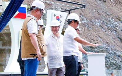 <p><strong>GAME CHANGER.</strong> President Ferdinand R. Marcos Jr. (right) leads the inauguration of the three dams of the Jalaur River Multipurpose Project II in Barangay Agcalaga, Calinog, Iloilo on Tuesday (July 16, 2024). The project, he said, also paves the way for future development of inland fishery, floating solar energy systems, and eco-cultural tourism in the area. <em>(PCO photo)</em></p>