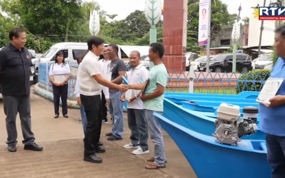 <p><strong>EL NIÑO AID</strong>. President Ferdinand R. Marcos Jr. leads the distribution of various government assistance to farmers, fisherfolk, and families affected by the El Niño phenomenon in Puerto Princesa City, Palawan on Thursday (July 18, 2024). Nearly PHP1 billion in financial assistance, services, loan assistance, and subsidies were distributed during the program. <em>(RTVM Screengrab)</em></p>