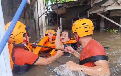 <p><strong>RESCUED.</strong> Philippine Coast Guard (PCG) members save a woman from floods in Zamboanga City on July 14, 2024. The NDRRMC reported Thursday (July 18, 2024) that the death toll from the effects of bad weather in Mindanao has climbed to seven. <em>(Photo courtesy of PCG)</em></p>