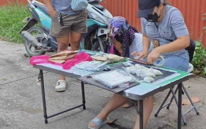 <p><strong>DRUG BUST</strong>. A Philippine National Police personnel conducts an onsite inventory of suspected shabu worth PHP3.4 million seized from a 20-year-old baker who was moonlighting as a drug peddler during a sting operation in Sitio Bangan, Cabancalan, Mandaue City, Cebu.The Philippine Drug Enforcement Agency-7 on Thursday (July 18, 2024) said five drug personalities were arrested in three separate sting operations in Cebu, Bohol, and Negros Oriental, and seized PHP4.8 million worth of shabu. <em>(Photo courtesy of PDEA-7)</em></p>