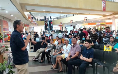 <p><strong>BIZ TALK.</strong> Edward Du (left), president of the Negros Oriental Chamber of Commerce and Industry, discusses business opportunities at the opening of the Dumaguete Coffee Festival on Friday (July 19, 2024) in Dumaguete City. Du is hoping that the recently created Negros Island Region will be included in the State of the Nation Address of President Ferdinand R. Marcos Jr. on Monday (July 22). <em>(PNA photo by Mary Judaline Flores Partlow)</em></p>