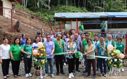 <p><strong>ASF RECOVERY EFFORTS.</strong> Members of the Tandag Livestock and Poultry Agriculture Cooperative receive a PHP10-million project from the Department of Agriculture in Barangay Pandanon, Tandag City, Surigao del Sur on Thursday (July 18, 2024). It is part of the government's recovery initiatives from the effects of the African swine fever. <em>(Photo courtesy of DA-13)</em></p>