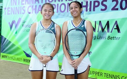 <p><strong>CHAMPIONS.</strong> Stefi Marithe Aludo (left) and Kimi Aiyana Brodeth won the girls' doubles title in the Phinma International Juniors Tennis Championships at Manila Polo Club courts in Makati City on Saturday (July 21, 2024). They beat fellow Filipinos Jana Jelena Nicole Diaz and Tennielle Madis, 6-4, 1-6, 10-5. <em>(Photo courtesy of Phinma)</em></p>