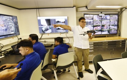 <p><strong>MOBILE COMMAND CENTER.</strong> Metropolitan Manila Development Authority Acting Chair Don Artes showcases the CCTV and drone capabilities of the new mobile command center during an unveiling and blessing ceremony along Commonwealth Avenue in Quezon City on Monday (July 22, 2024). Artes said the MCC would be used to manage traffic and monitor vital areas for President Ferdinand R. Marcos' 3rd State of the Nation Address. <em>(Photo courtesy of MMDA)</em></p>