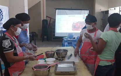 <p><strong>TRAINING.</strong> Parents of child laborers in Negros Oriental attend a baking course offered by the Technical Education And Skills Development Authority in this undated photo. The Department of Labor and Employment is set to release more than PHP3.4 million in livelihood projects to 118 parents of child laborers in Negros Oriental. <em>(Photo courtesy of DOLE Negros Oriental)</em></p>