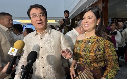 <p><strong>FILIPINO WEAVES.</strong> Cavite 2nd District Rep. Lani Mercado, who was with her husband Senator Bong Revilla, showcases the colors of Mindanao through an inaul modern dress, a hand-loomed fabric from Maguindanao on Monday (July 22, 2024) at the 3rd State of the Nation Address in Quezon City. Guests in today's SONA mostly wore Filipiniana dresses and barong.<em> (PNA photo by Joyce Ann Rocamora)</em></p>