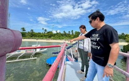 <p><strong>CEASE-AND-DESIST.</strong> Lapu-Lapu City Mayor Junard Chan inspects the jumping balloon facility of a resort in Barangay San Vicente, Olango Island in Cebu province on Sunday (July 21, 2024). Chan said he ordered the temporary closure of Pinky's Floating Cottage pending a review of safety measures in the facilities following the death of a 45-year-old tourist from Cagayan de Oro City. <em>(Photo courtesy of Mayor Junard Chan)</em></p>