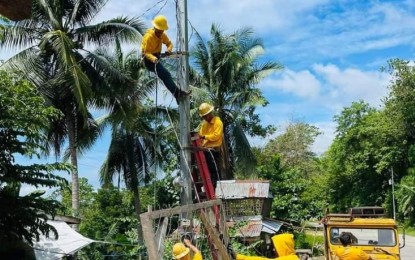 <p><strong>POWER SUPPLY</strong>. Linemen of Northern Negros Electric Cooperative (Noneco) replace a toppled secondary pole in Toboso town on July 19, 2024. On Monday (July 22, 2024), the Noneco management announced an increase of PHP6.5625 per kilowatt hour in average residential power rate for July. <em>(Photo courtesy of Northern Negros Electric Cooperative)</em></p>