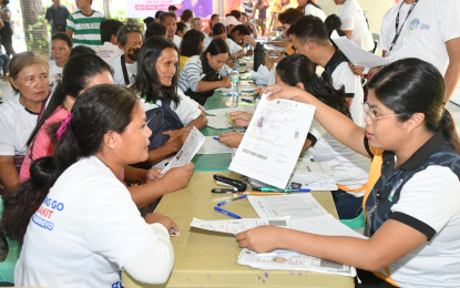 <p><strong>HOUSING AID.</strong> Beneficiaries in Sagay City, Negros Occidental process their requirements with personnel of the National Housing Authority to receive financial assistance of PHP10,000 to help rebuild their homes damaged by Typhoon Egay last year. A total of 617 Sagaynon families received a total of PHP6.17 million under the Emergency Housing Assistance Program of the NHA on July 20, 2024. (<em>Photo courtesy of Sagay City Information and Tourism Office)</em></p>