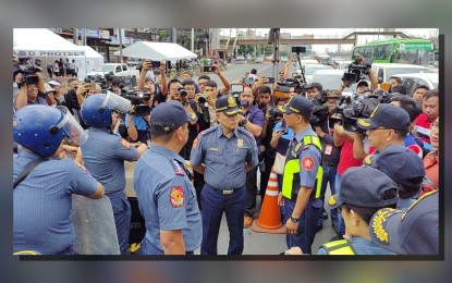 <p><strong>READY FOR SONA.</strong> PNP chief Gen. Rommel Francisco Marbil (center) inspects the deployment of police officers along Commonwealth Avenue in Quezon City on Monday (July 22, 2024) ahead of President Ferdinand R. Marcos Jr.'s third SONA. Marbil said cops would exercise maximum tolerance in dealing with protesters but with limitations. <em>(PNA photo by Lloyd Caliwan)</em></p>