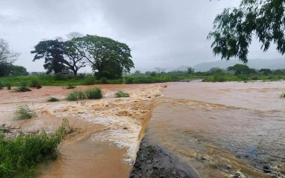 <p><strong>INUNDATED</strong>. The road connecting Barangay Estancia to Sitio Bangalan and Utoy in Piddig, Ilocos Norte is now flooded due to the continuous rains brought about by the southwest monsoon and Typhoon Carina. The province has been placed under red rainfall warning. <em>(Photo courtesy of Piddig MDRRMO)</em></p>