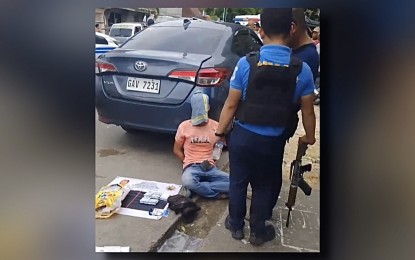 <p><strong>BUSTED.</strong> The suspected drug peddler sits with his face covered as police account for the suspected shabu, valued at PHP6.8 million, seized from him during a buy-bust operation in Barangay Awang, Datu Odin Sinsuat, Maguindanao del Norte on Tuesday afternoon (July 23, 2024). The suspect, Morsalen Tantong, claimed he was unaware his companions carried illegal drugs as he only served as their driver. <em>(Photo from Ebs Abang/DXMY)</em></p>