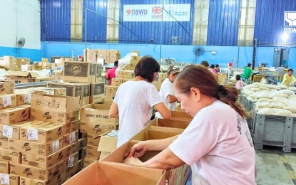 <p><strong>DISASTER RESPONSE</strong>. Volunteers help repack family food packs (FFPs) at the Department of Social Welfare and Development (DSWD) National Resources Operations Center in Pasay City on Wednesday (July 24, 2024). DSWD Assistant Secretary for Disaster Response Management Group (DRMG) Irene Dumlao on Thursday (July 25) said that aside from food packs and other immediate disaster response, the agency will also assist affected families after the disaster, or during the recovery phase. <em>(Photo courtesy of DSWD)</em></p>