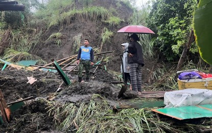 <p><strong>DEADLY LANDSLIDE</strong>. Authorities inspect a landslide incident in Sitio Manalao in Barangay Subic Ilaya, Agoncillo, Batangas on Wednesday (July 24, 2024). The landslide killed four, including a pregnant woman and her nine-year-old daughter. <em>(Photo courtesy of Agoncillo, Batangas Facebook page)</em></p>