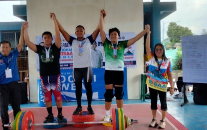 <p><strong>CV LIFTERS RULE.</strong> June Micael Jaluag of Central Visayas (center) bagged three gold medals in the men's 94kg category of the 2024 Private Schools Athletic Association (PRISAA) National Games weightlifting competition at the Gogon Central School in Legazpi City, Albay on Wednesday (July 24, 2024). Czar Angelo Bangoy (Soccsksargen) secured three silvers and Jhon Benedict Jacob (Bicol Region) got three bronzes. <em>(PNA photo by Jean Malanum) </em></p>