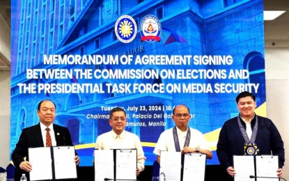 <p><strong>MEDIA PROTECTION</strong>. Commission on Elections chairman George Garcia (2nd from left) and Presidential Task Force on Media Security executive director, Undersecretary Paul Gutierrez (3rd from left), sign a memorandum of agreement on Tuesday (July 23, 2024). The agreement aims to ensure the safety and respect for the rights of the members of the press covering the elections. <em>(Photo from PTFoMS)</em></p>