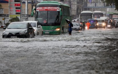 <p><strong>WATERWORLD</strong>. Motorists brave floods along Quezon Avenue corner GMA Avenue in Quezon City as the enhanced southwest monsoon and Typhoon Carina drenched the metropolis on Wednesday (July 24, 2024). The Department of Budget and Management said the government still has some PHP11.123 billion in calamity fund to cushion the impact of the massive floods and heavy rains that swept several regions including Metro Manila. <em>(PNA photo by Yancy Lim)</em></p>