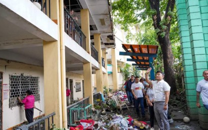 <p>SCHOOL DAMAGE. Education Secretary Sonny Angara visits the disaster-affected Masambong High School in Quezon City on July 25, 2024. The Department of Education on Friday (July 26, 2024) reported that at least 738 schools will postpone their school opening on July 29. (<em>Photo courtesy of Sonny Angara Facebook Page)</em></p>