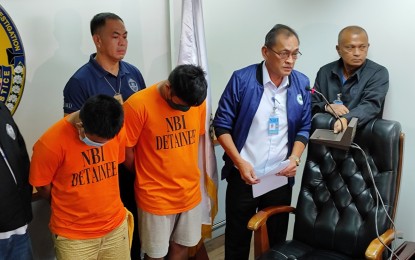 <p><strong>CAUGHT.</strong> Former inmate Raymond David Reyes and Correction Officer I Pio Jonathan Eulalio are presented to the media at the National Bureau of Investigation headquarters in Quezon City on Friday (July 26, 2024). The two are implicated in the kidnapping and killing of an elderly mother and her son in Baesa, Quezon City on June 10. <em>(NBI photo)</em></p>