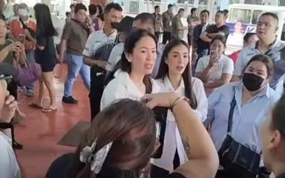 <p><strong>RELIEF OPS.</strong> Senate Spouses Foundation, Inc. (SSFI) President Heart Evangelista-Escudero (right) and Special Envoy to the United Arab Emirates for Trade and Investment and SSFI officer Kathryna Yu-Pimentel (left) lead the distribution of relief goods to flood-affected families temporarily sheltered at the Sto. Niño Elementary School in Marikina City on Friday (July 26, 2024). The evacuees received bags containing rice, canned goods, vitamin C tablets and other essential food products, as well as sleeping kits, toiletries and hygiene kits for women. <em>(Screenshot from Kat Pimentel FB Page)</em></p>