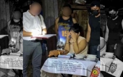 <p><strong>BUSTED.</strong> A 33-year-old female suspect sits in front of the PHP6.1 million worth of white crystalline substance suspected to be shabu confiscated from her during a sting operation on Friday night (July 26, 2024). The police said the arrest came after weeks of surveillance. <em>(Contributed photo)</em></p>